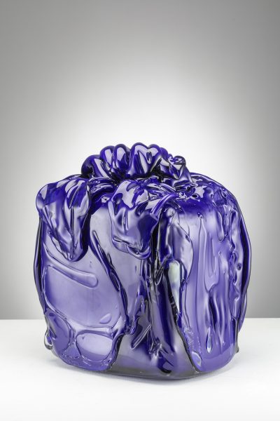 An artwork by Osman Yousefzada. A square object appears wrapped in a shiny purple covering.