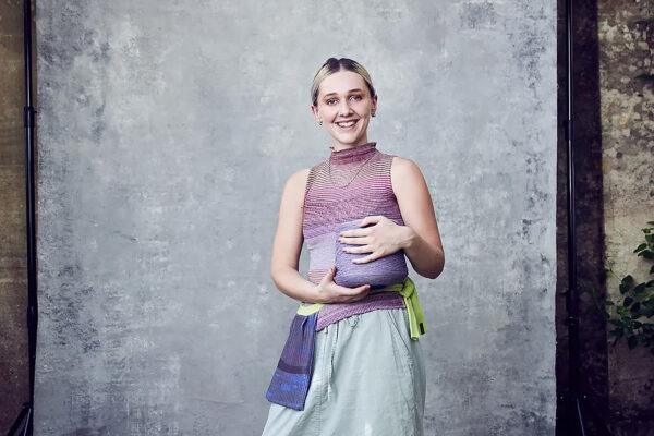 Artist Millicent Sanders holds a ball of wool.