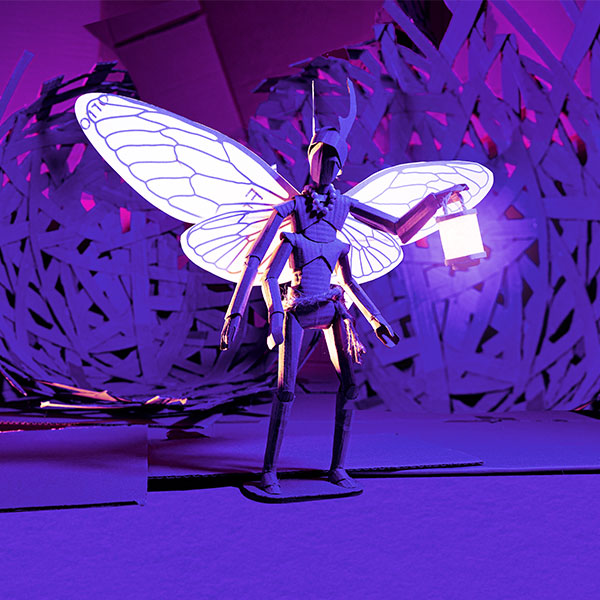 A bug holding a lantern with lit up wings against a forest style backdrop, all of which is made out of cardboard