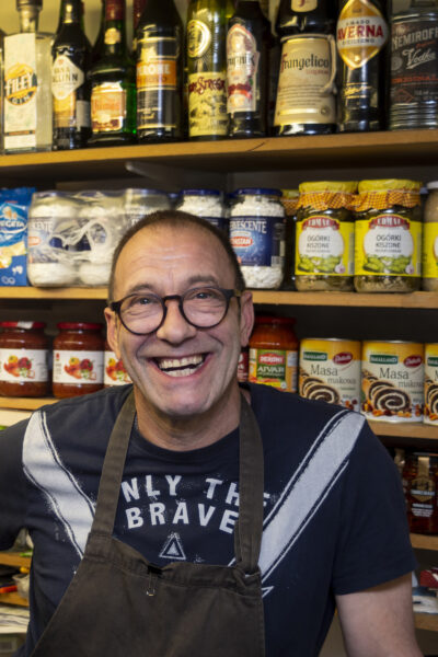 Deli owner Gunther stands in his shop.