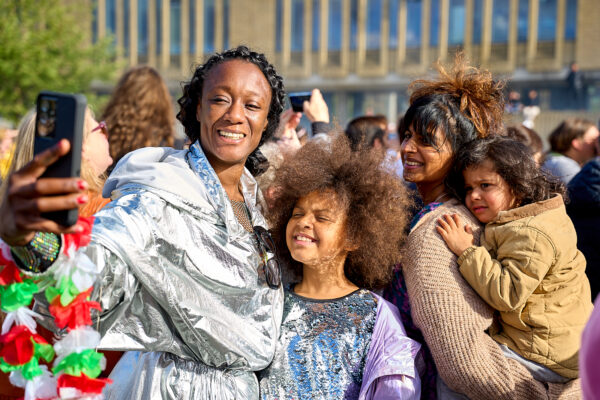 A group of people pose at an event