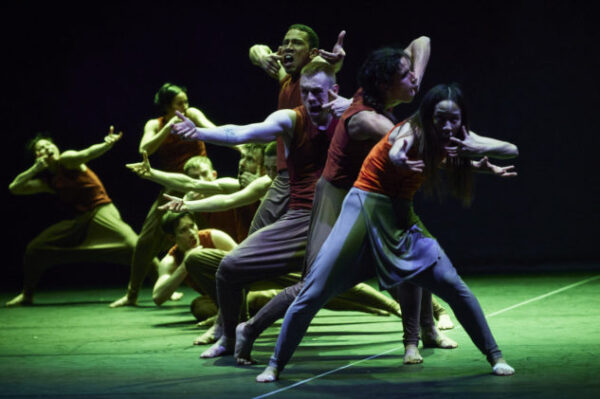 A row of performers on stage - production image from Jungle Book reminagined