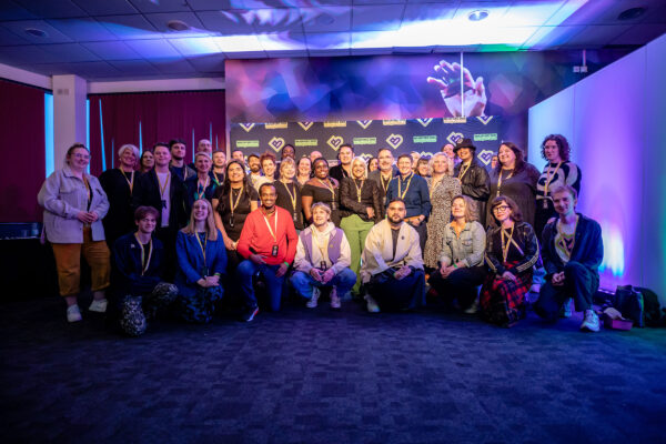 A large group of people - some of the Bradford 2025 team standing in a row together for a team photo.