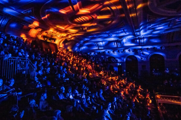 The packed auditorium, full of people