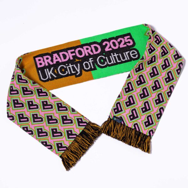 A colourful scarf in Bradford 2025 brand colours, against a white background. The scarf has a pattern using the Bradford 2025 heart symbol and includes the Bradford 2025 UK City of Culture logo.