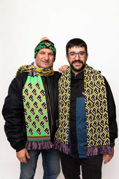 Two models wearing Bradford 2025 scarves.