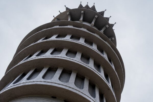 Detail looking up at a large public artwork called Tower of Now