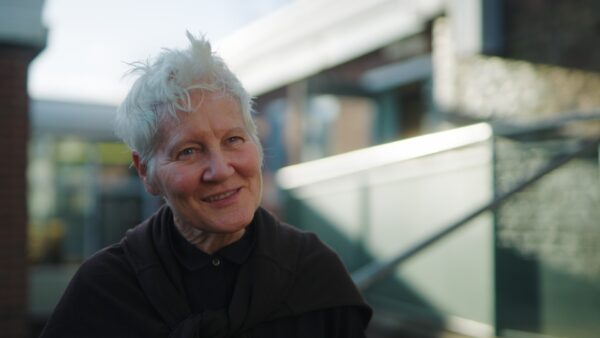 headshot outside of older lady with short grey hair