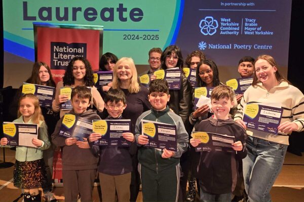 A group of children holding certificates pose with Mayor of West Yorkshire, Tracy Brabin