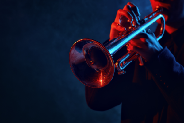 Blue and red lit trumpet being played