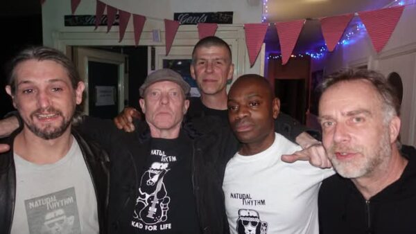 Five men stand together and pose for the camera