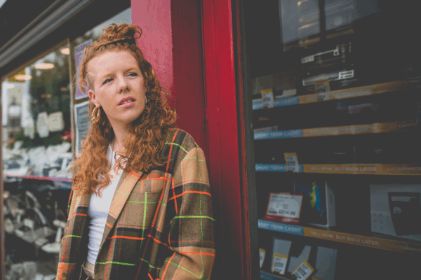 Kirsty Taylor leant against a shop window