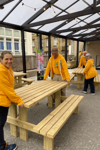 Volunteers smiling outside Loading Bay