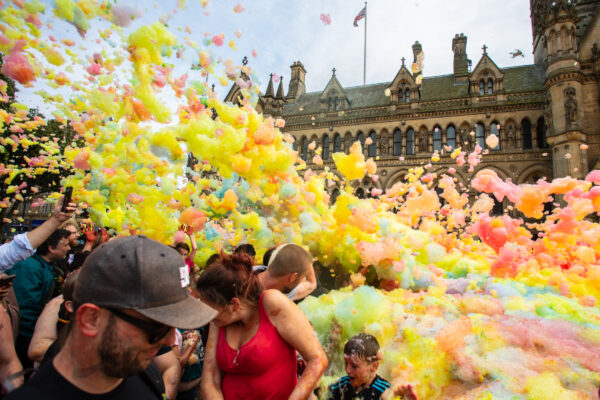 Multicoloured foam flying in the air in front of city hall