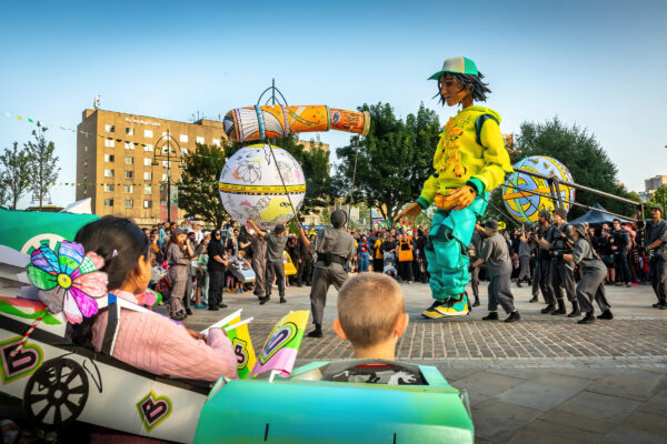 Zee, dressed in a yellow and blue tracksuit in Bradford's Mirror Pool.
