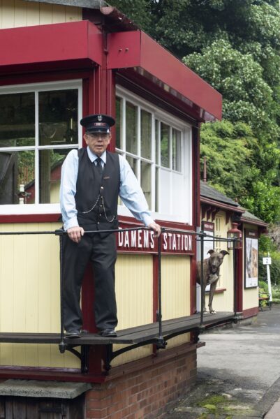 Station master, at the control box of train station