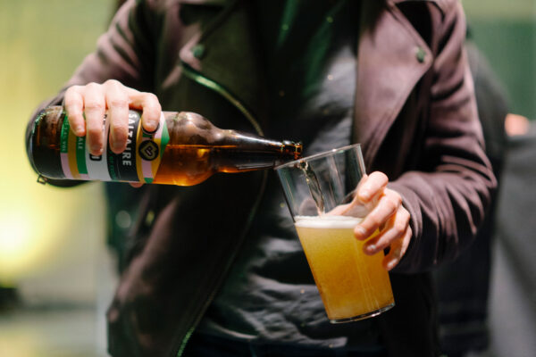 A person pours Be Bold into a glass - the Bradford 2025 beer from Saltaire Brewery.