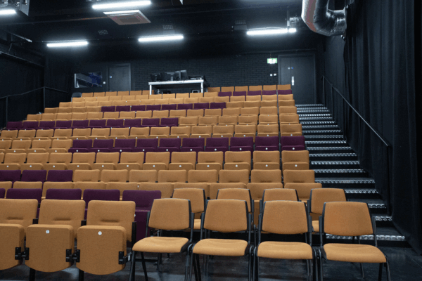 Theatre seats inside the auditorium at Loading Bay