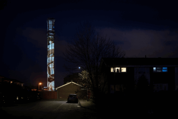 Projections on an old mill chimney