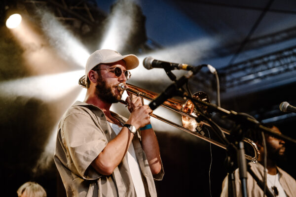 Man playing a trumpet on stage.