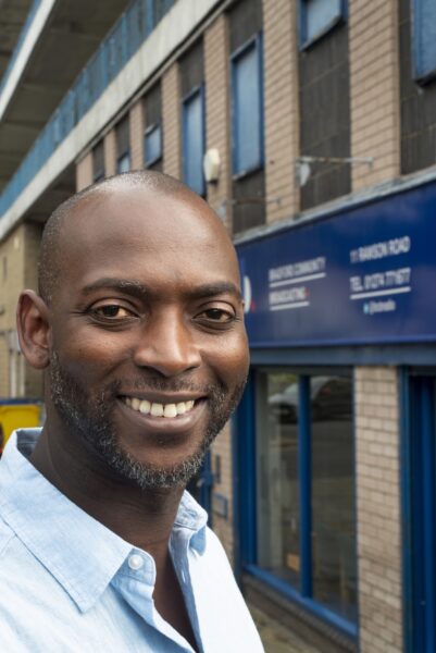Male radio presenter smiling outside BCB Radio