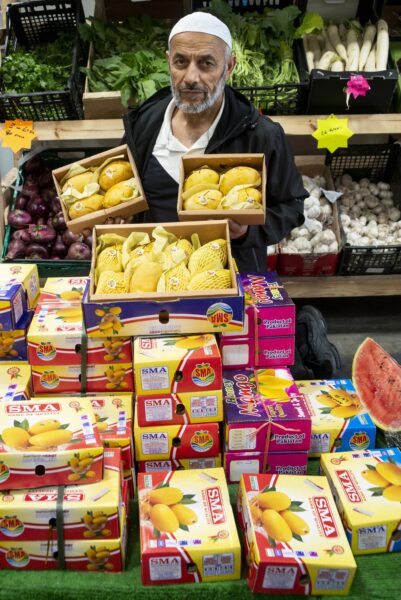 Zummard Hussain, who sells Pakistani mangos at his shop Jack Fruit, Veg and Catering Supplies in Keighley. Photo by Tim Smith.