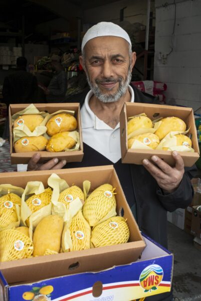 Zummard Hussain, who sells Pakistani mangos at his shop Jack Fruit, Veg and Catering Supplies in Keighley. Photo by Tim Smith.