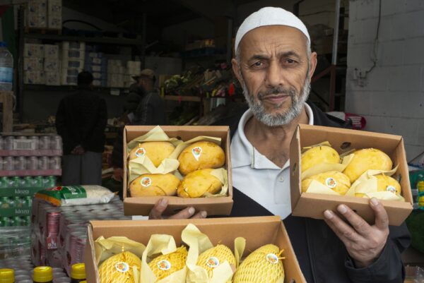 Zummard Hussain, who sells Pakistani mangos at his shop Jack Fruit, Veg and Catering Supplies in Keighley. Photo by Tim Smith.