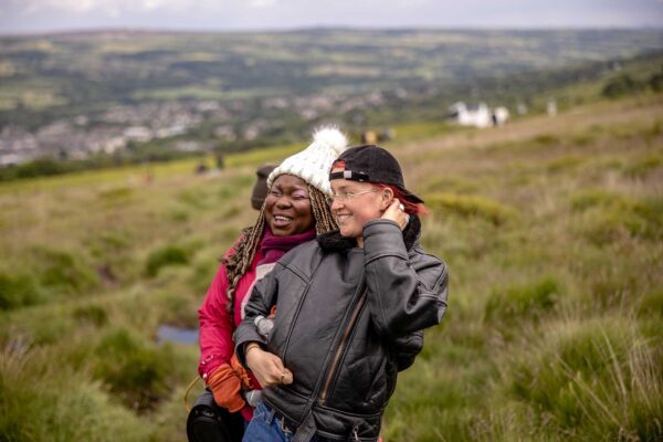 Two walkers explore Bradford's rural landscape.