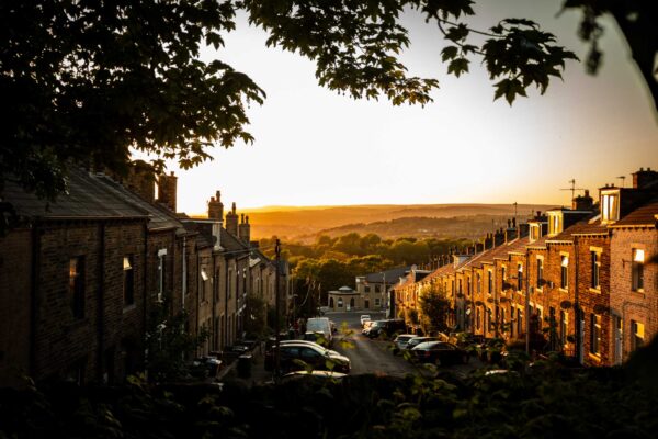 A row of houses in Bradford in the light of an early summer sunet.