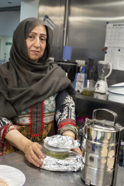 staff and members of Womenzone, a community centre just off Leeds Road in Bradford. These photos show typical everyday activites such as exercise classes, socialising, cooking and the sharing of a meal. Photos by Tim Smith.
