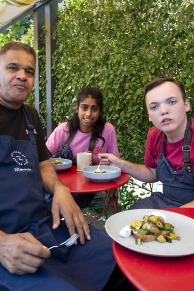 L-R, Amjad, Ajeema and Thomas. People harvesting food from the allotments at NEET (the Northcliffe Environmental Enterprise Team) in Northcliffe Park, where they meet several times a week. They then prepare what tehy have picked to make a lunch which they share. Photo by Tim Smith.