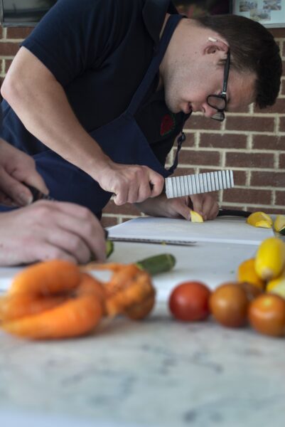 Oliver. People harvesting food from the allotments at NEET (the Northcliffe Environmental Enterprise Team) in Northcliffe Park, where they meet several times a week. They then prepare what tehy have picked to make a lunch which they share. Photo by Tim Smith.