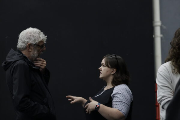 Two people talk.