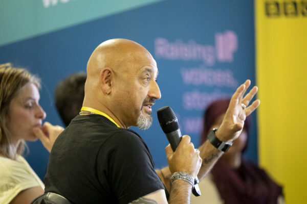 A man speaks into the microphone.