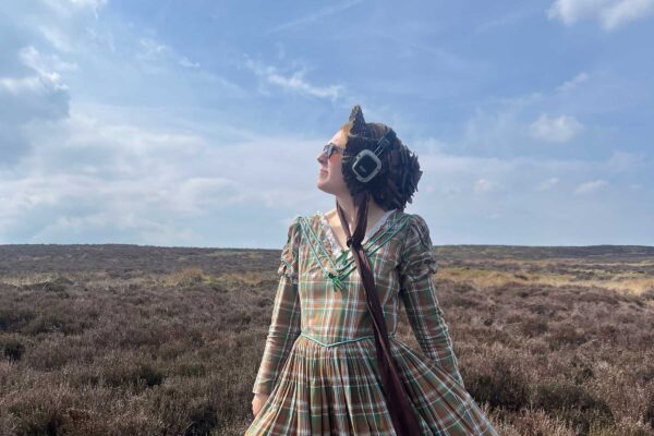 Lady on the moors, dressed as one of the Bronte sisters.