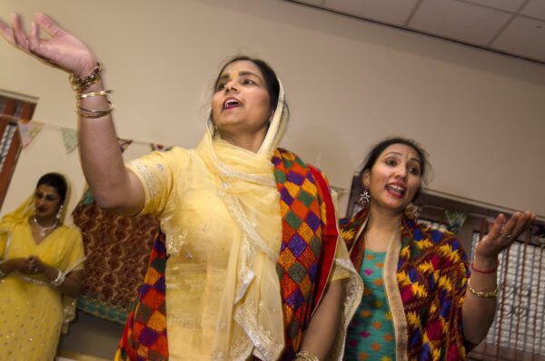A song and dance session organised as part of the Loving Grannies' Music project at Womenzone community centre. Photos by Tim Smith.