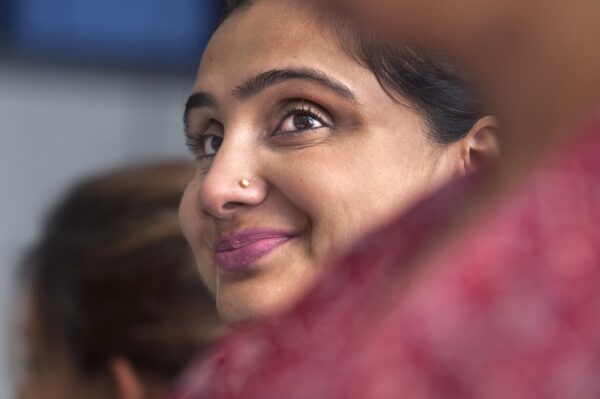 A close up of a young ladies face at a song and dance session organised as part of the Loving Grannies' Music project at Womenzone community centre. Photos by Tim Smith.
