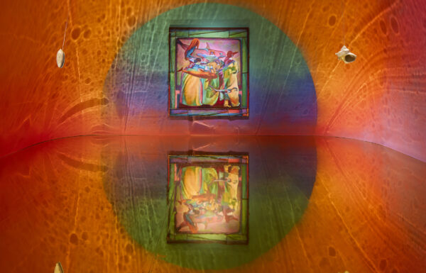 An orange coloured room with reflective floor. There is a large pinting on a wall in front of us with some human figures and marine life.
