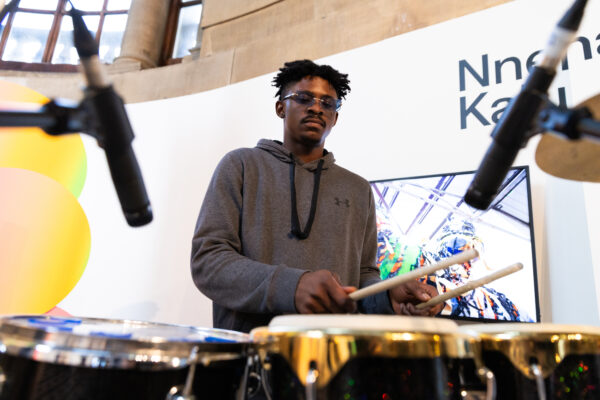 A man drumming in Cartwright Hall Art Gallery