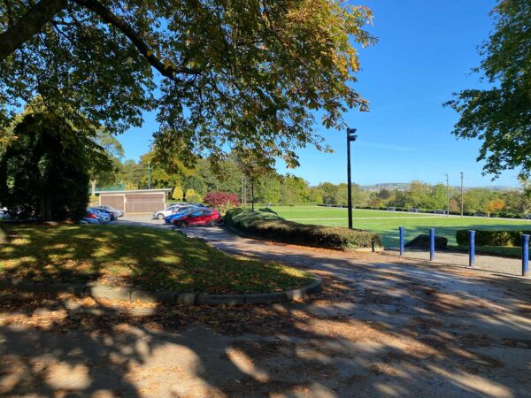 A road leading to a car park in Lister Park