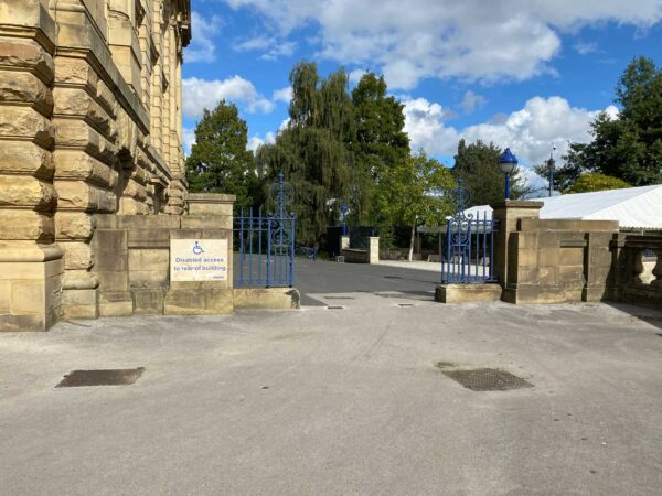 A blue gate, next to Cartwright Hall.