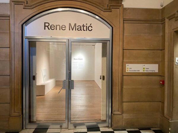 A large doorway with Rene Matić written above it.
