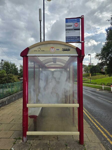 A red and white bus stop.