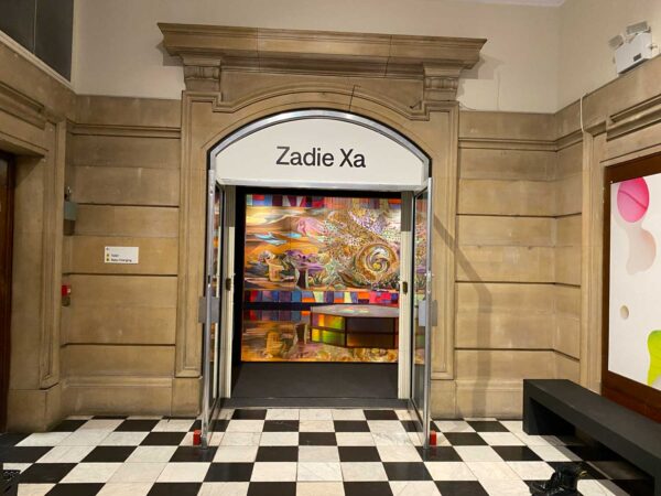 A large doorway with Zadie Xa written above it.