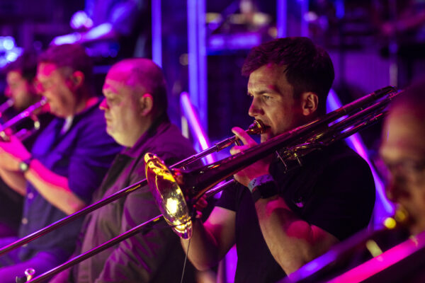 A Brass band, a man is playing the trumpet