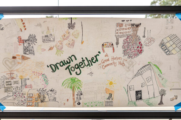 A drawing including lots of doodles of buildings and nature around bradford, with the words 'drawn together' in the centre