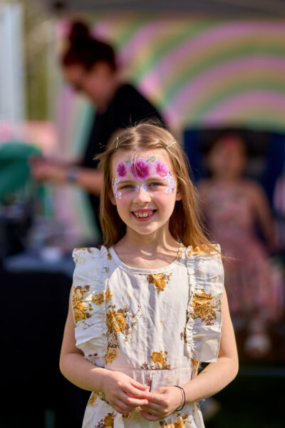 A girl with a painted face.