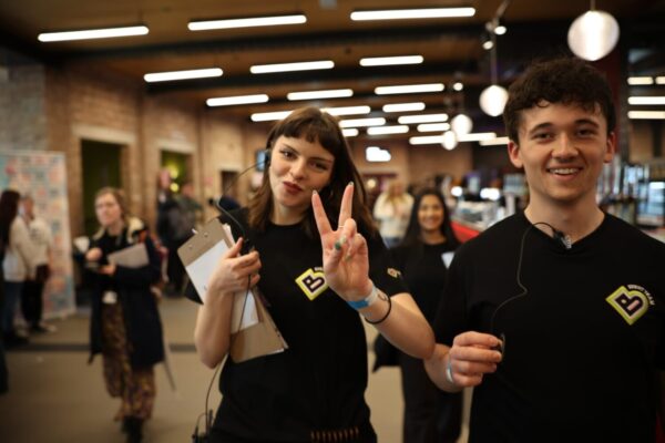 Two young people in Bradford 2025 event t-shirts posing to the camera.