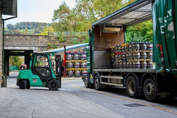 Caskets of beer loaded onto a lorry.
